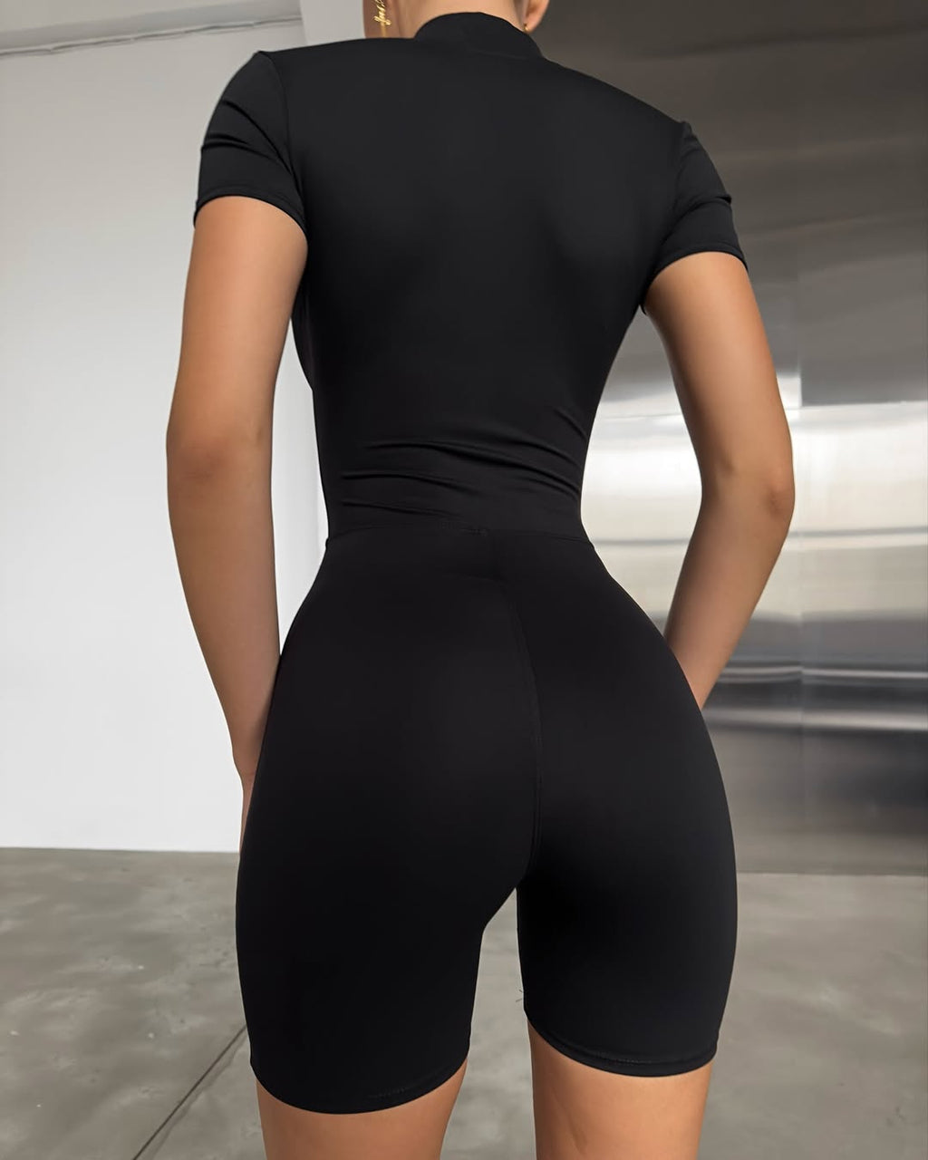 Nova Short-Sleeve Zip Romper in Black