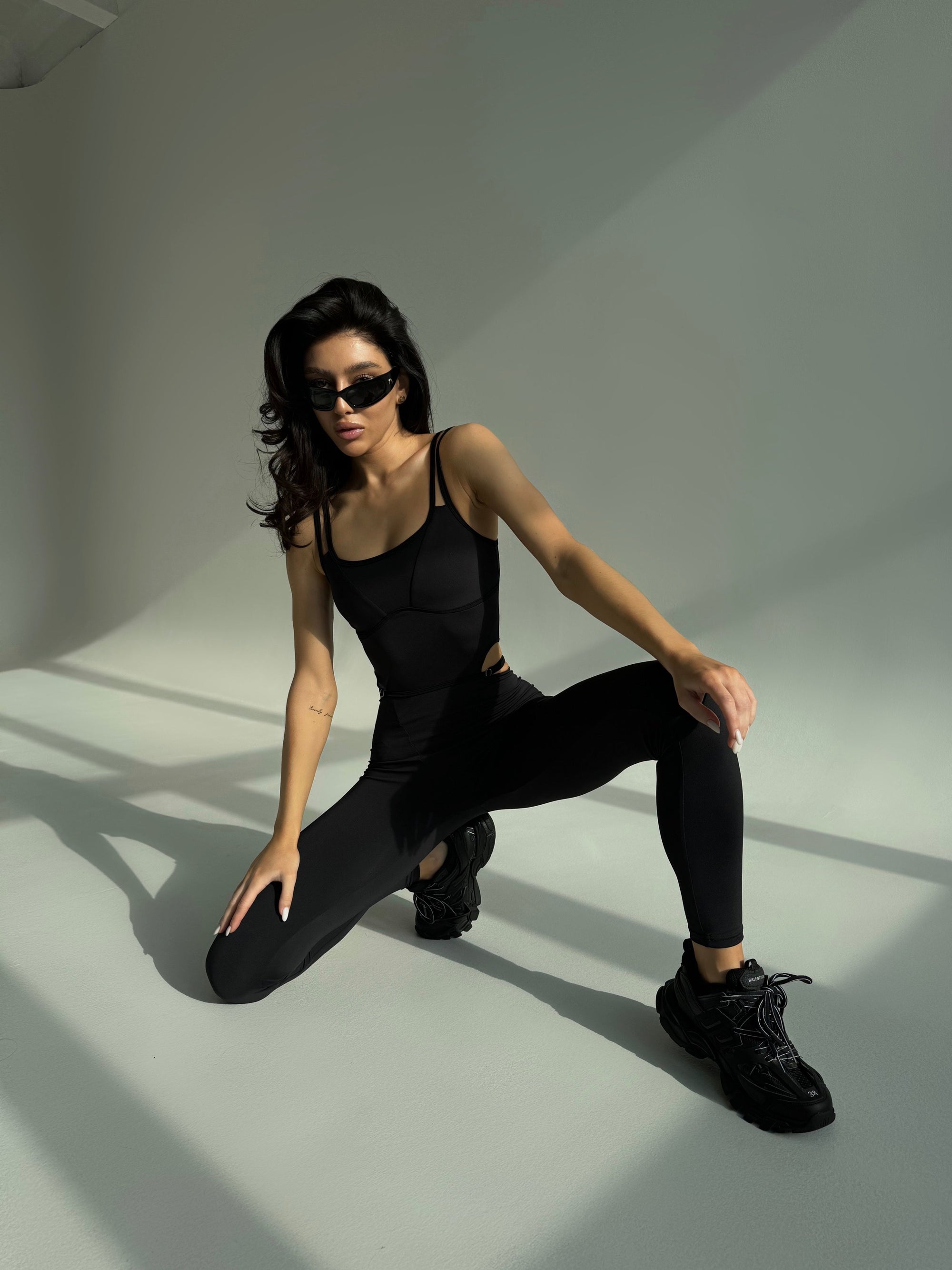 Elabria Strappy Contour Cut Out Unitard Jumpsuit in Black