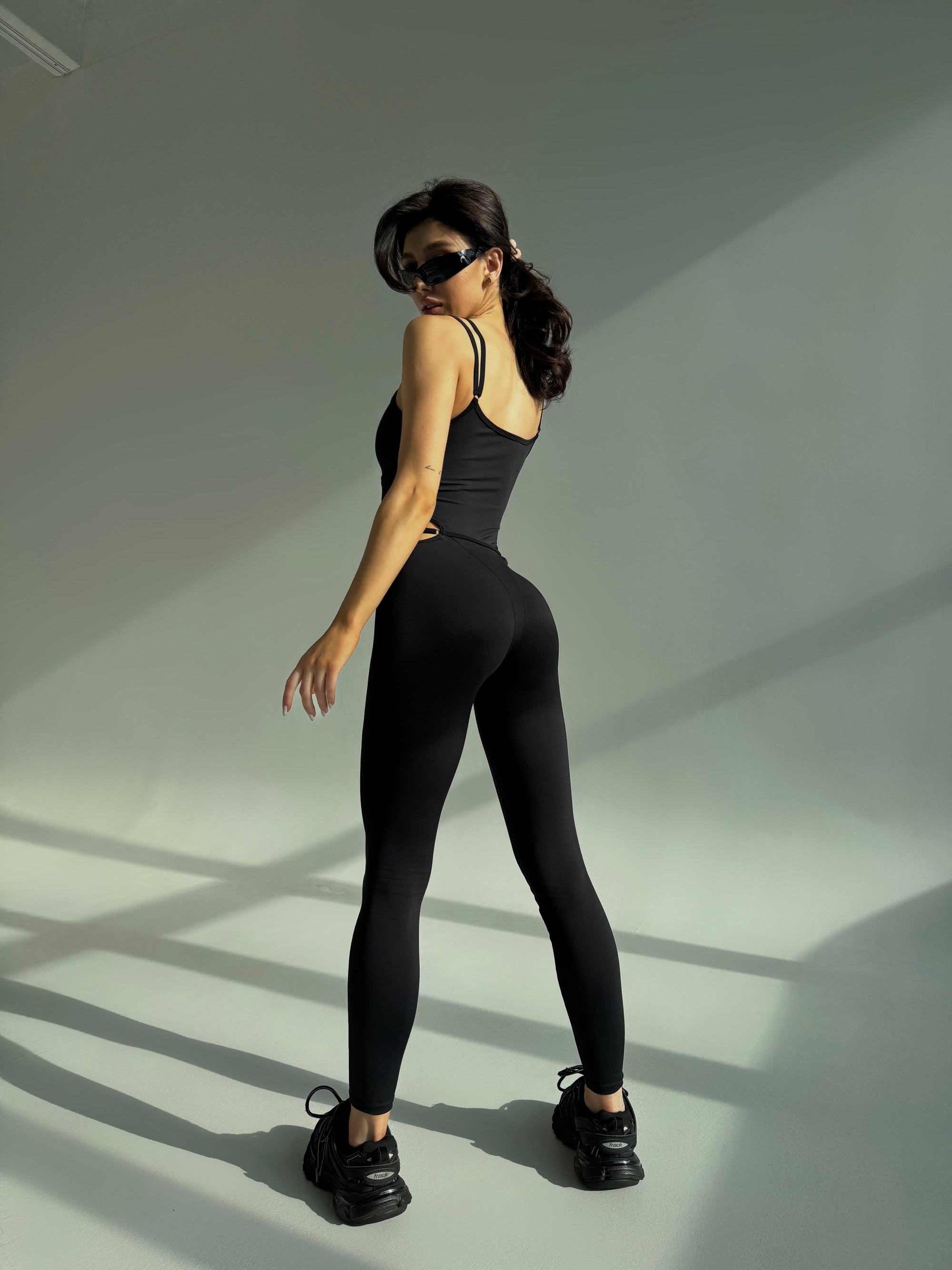 Elabria Strappy Contour Cut Out Unitard Jumpsuit in Black