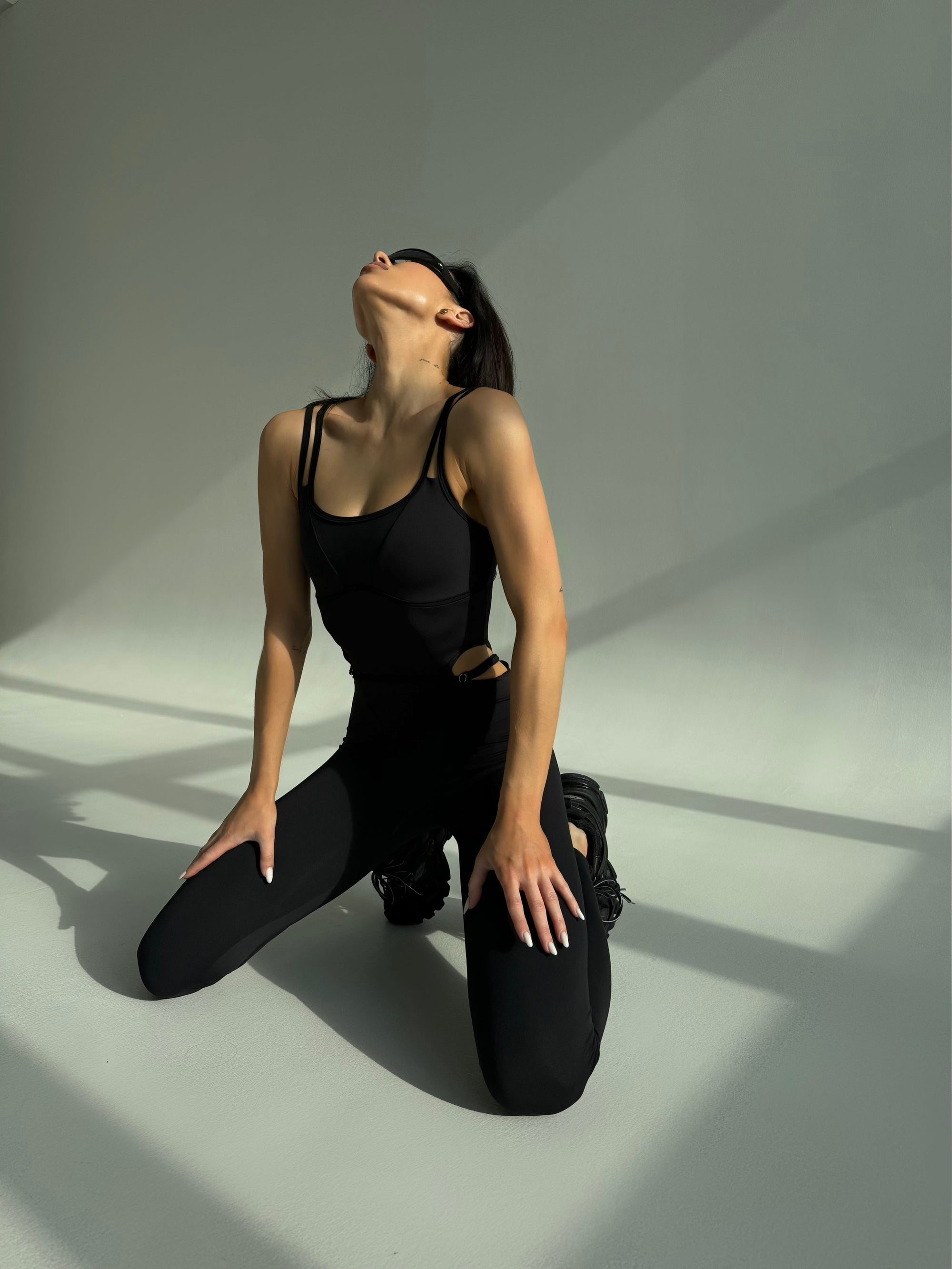 Elabria Strappy Contour Cut Out Unitard Jumpsuit in Black